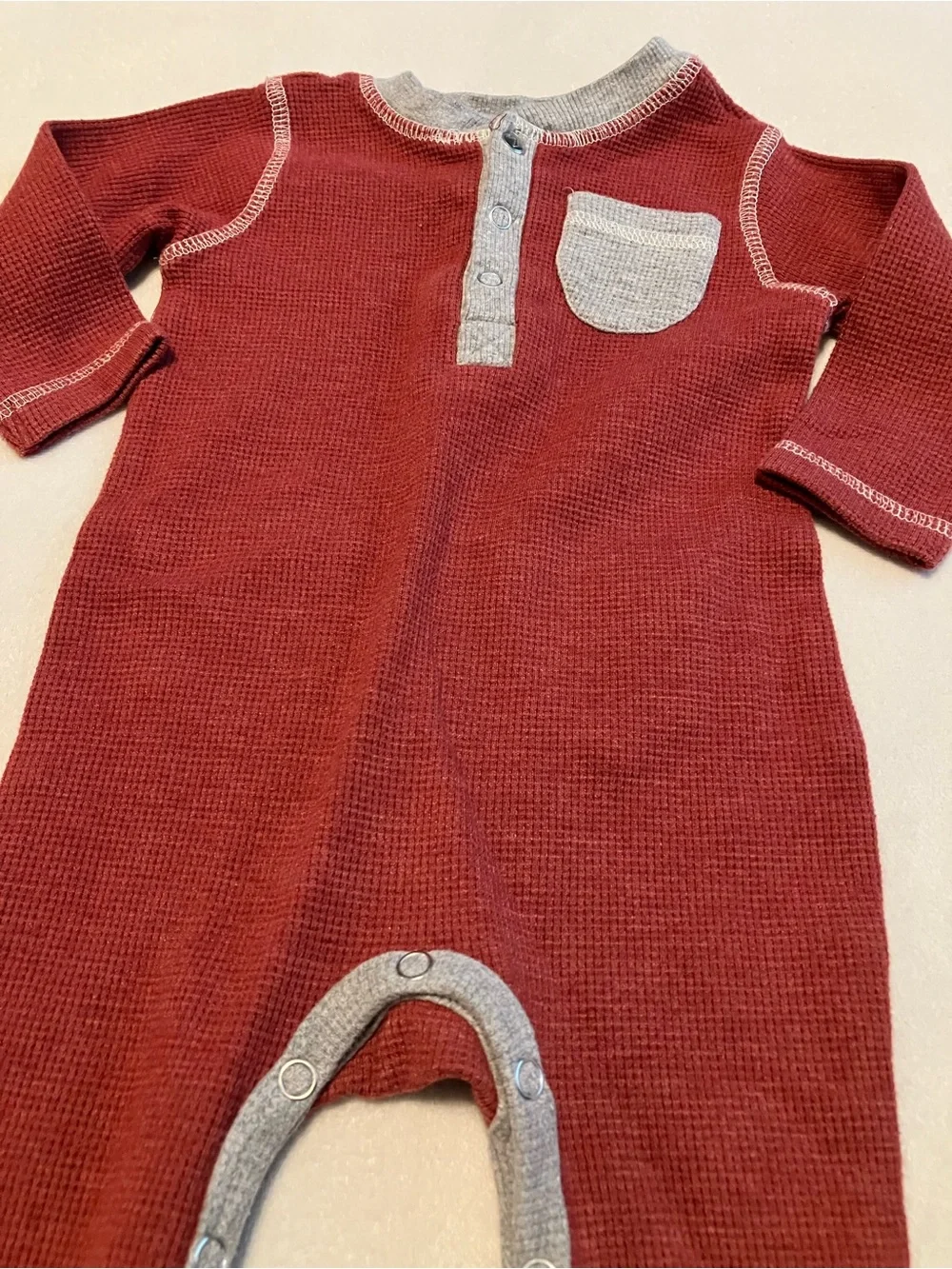 Cozy Red Waffle-Knit Baby One-Piece with Chest Pocket